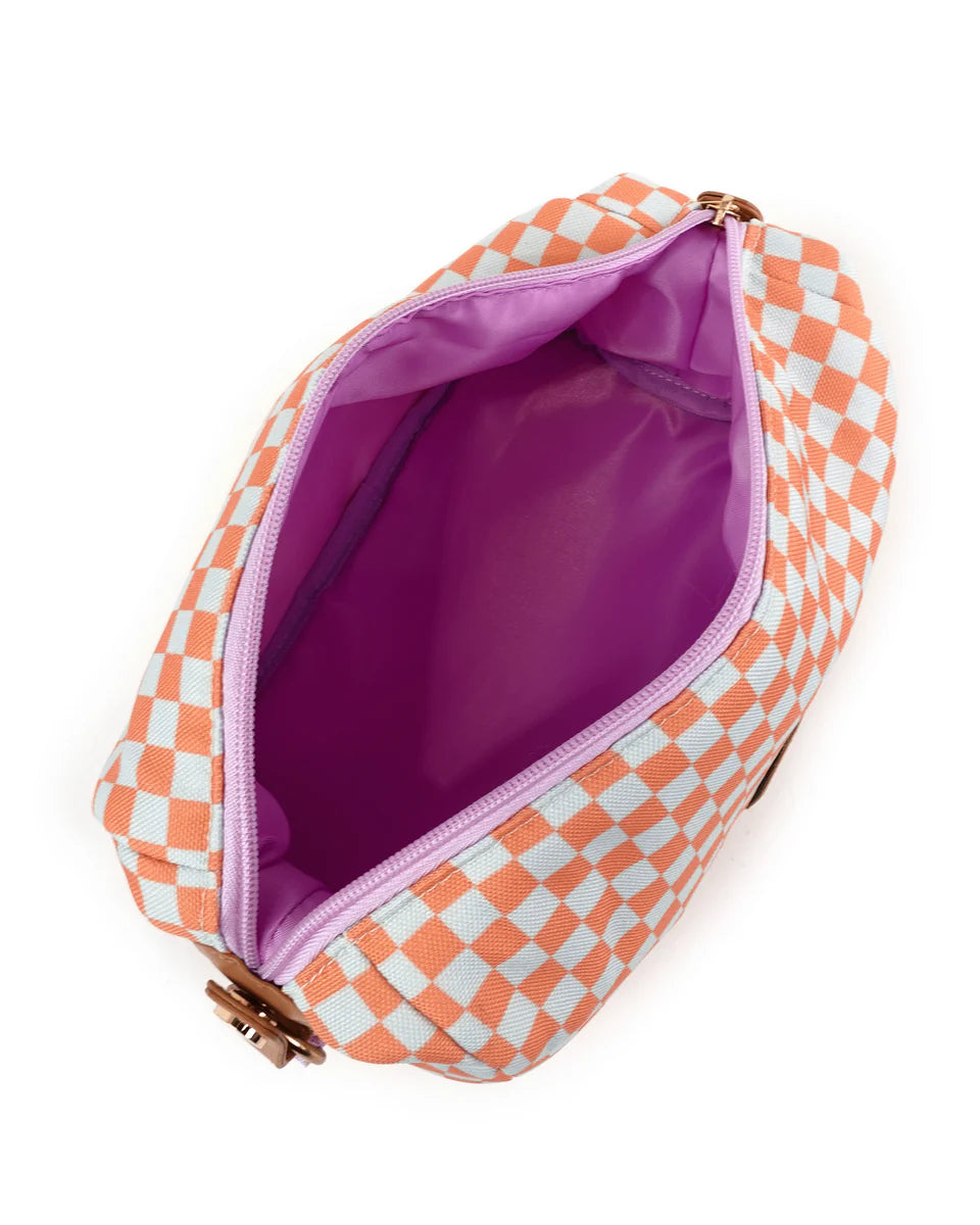 Opening zip of cosmetic bag showing lilac lining inside.