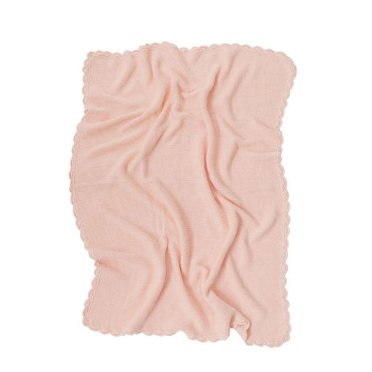 Pink textured blanket on a white background