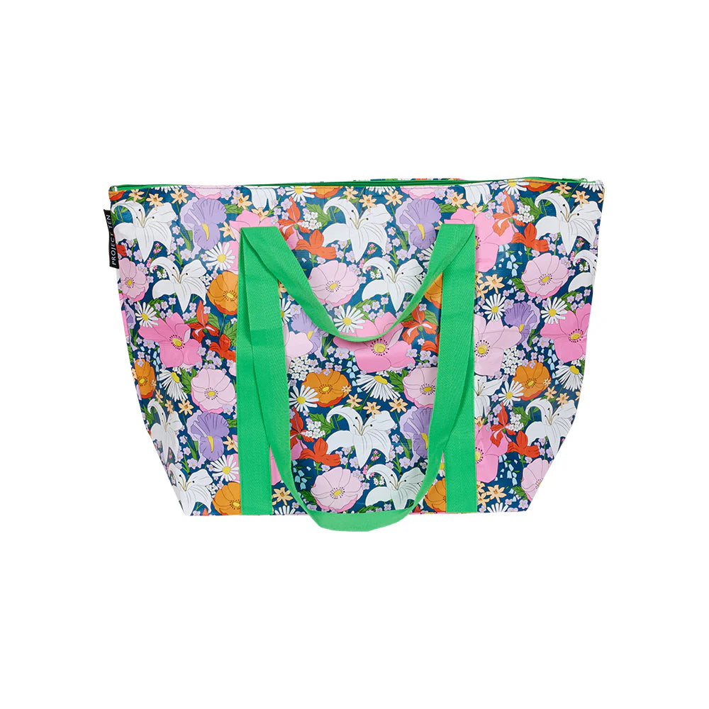Floral tote bag with green handles and a green top zip on a white background
