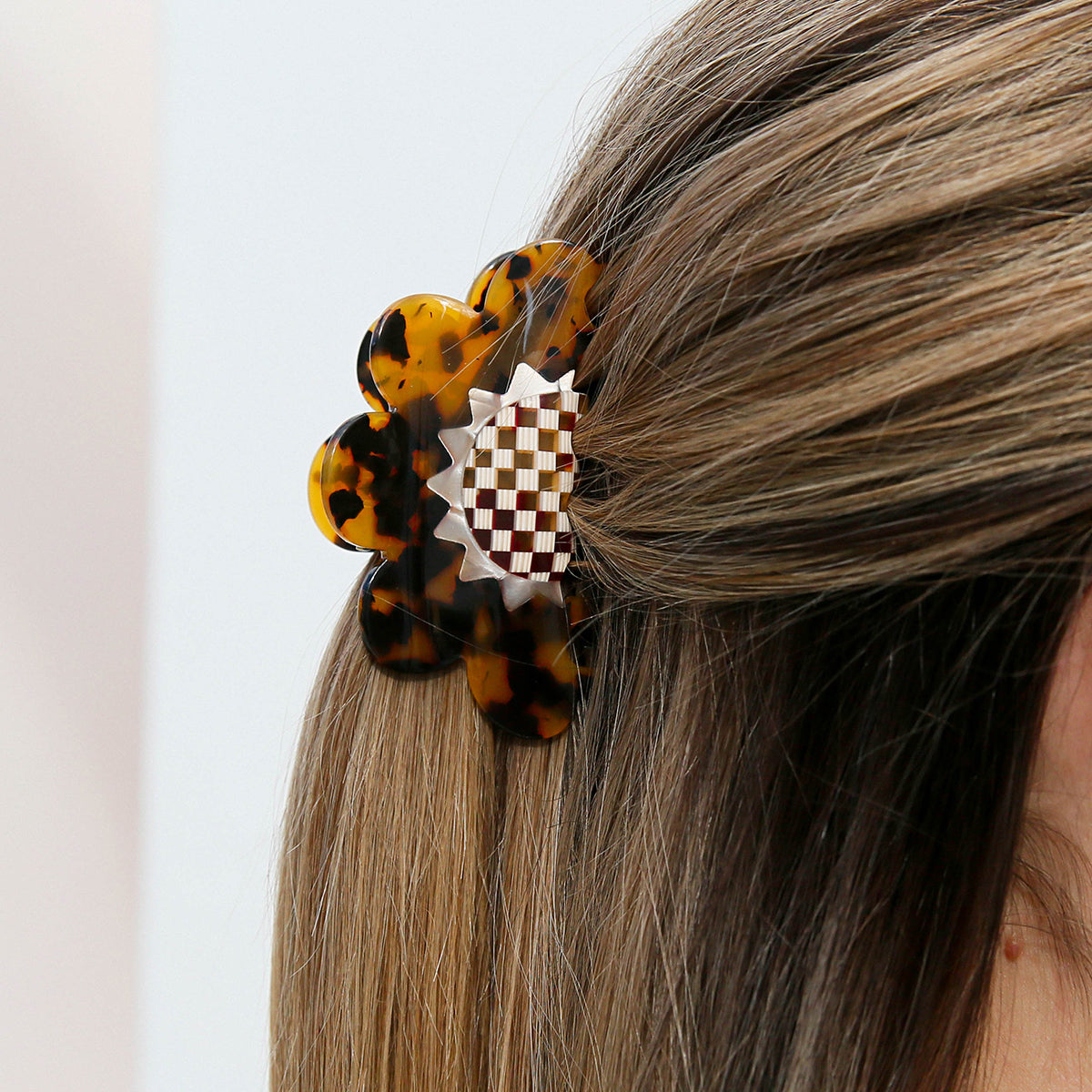 Flower shape tortoise brown colour hair claw in hair, half up half down up do.