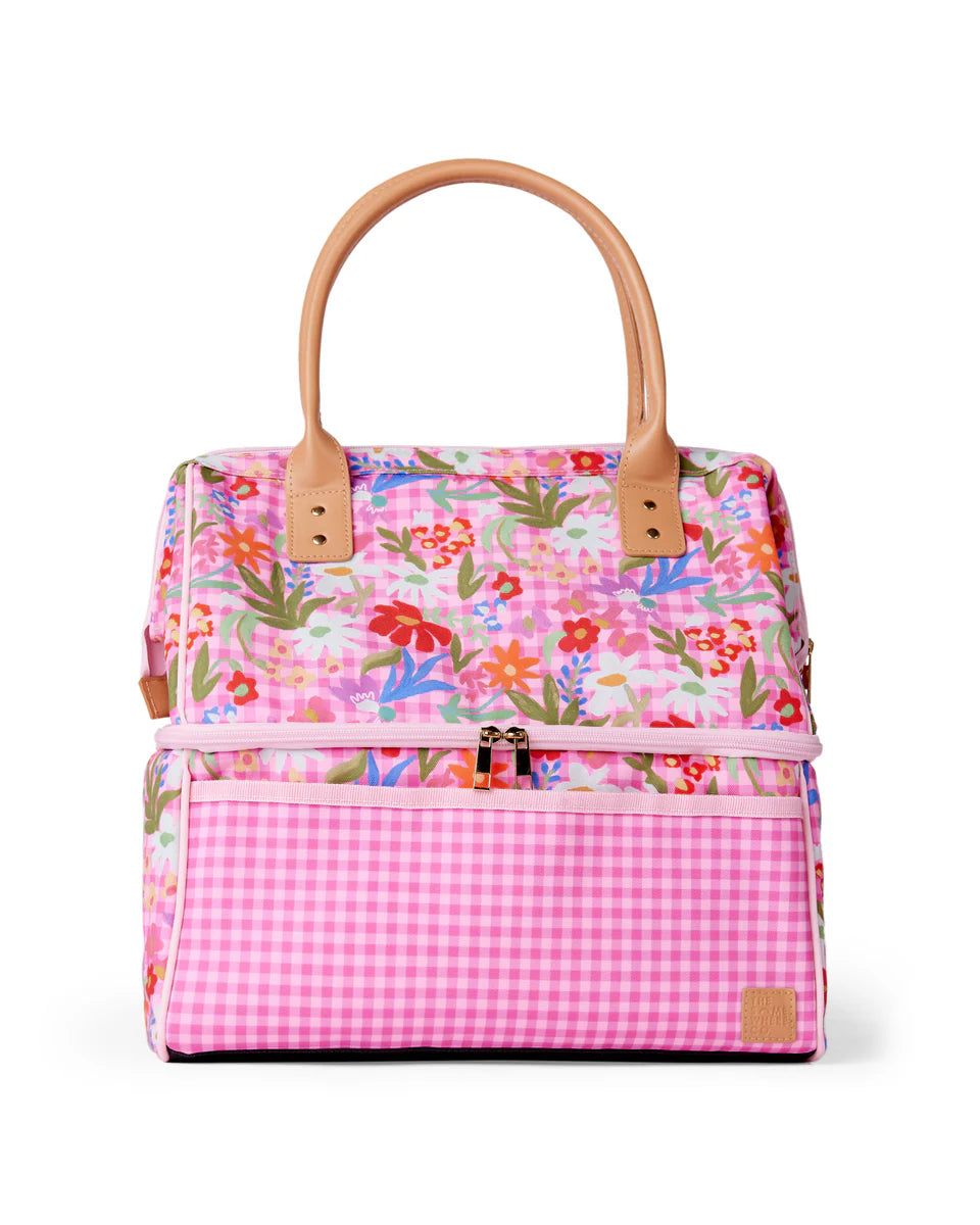 Cooler bag on white background. Colours of cooler bag include pink gingham and colourful floral print