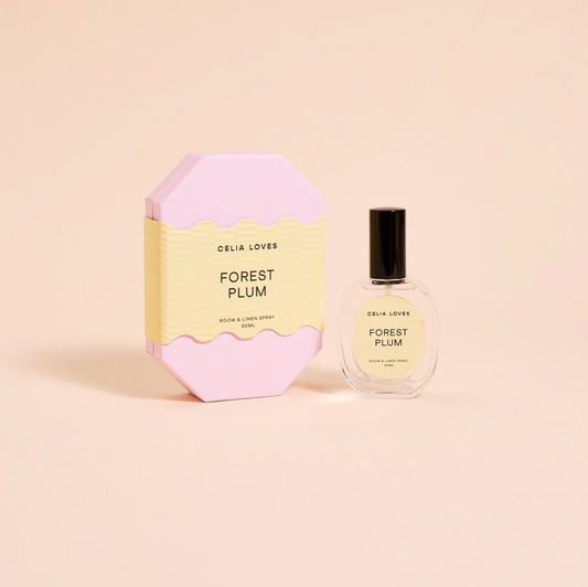 Celia Loves Forest Plum perfume bottle and packaging on a beige background