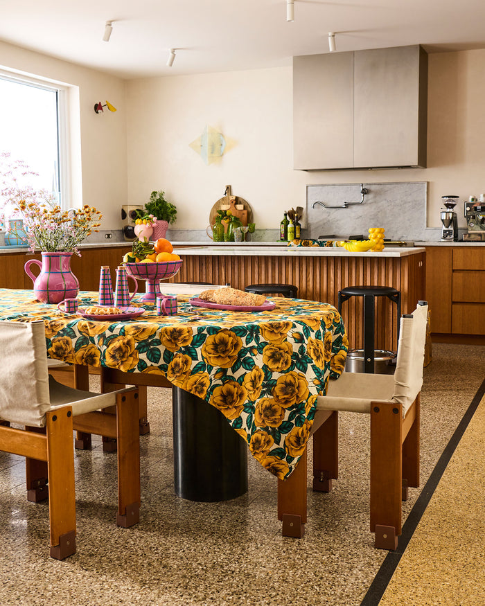 Kitchen with a dining table set and floral tablecloth