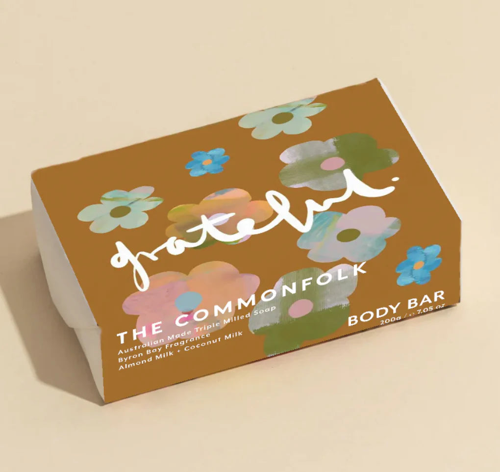 Body bar packaging with floral design and 'The Commonfolk' branding on a beige background