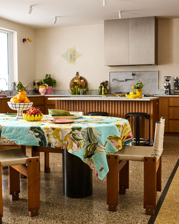 Kitchen with a dining table set and colorful tablecloth