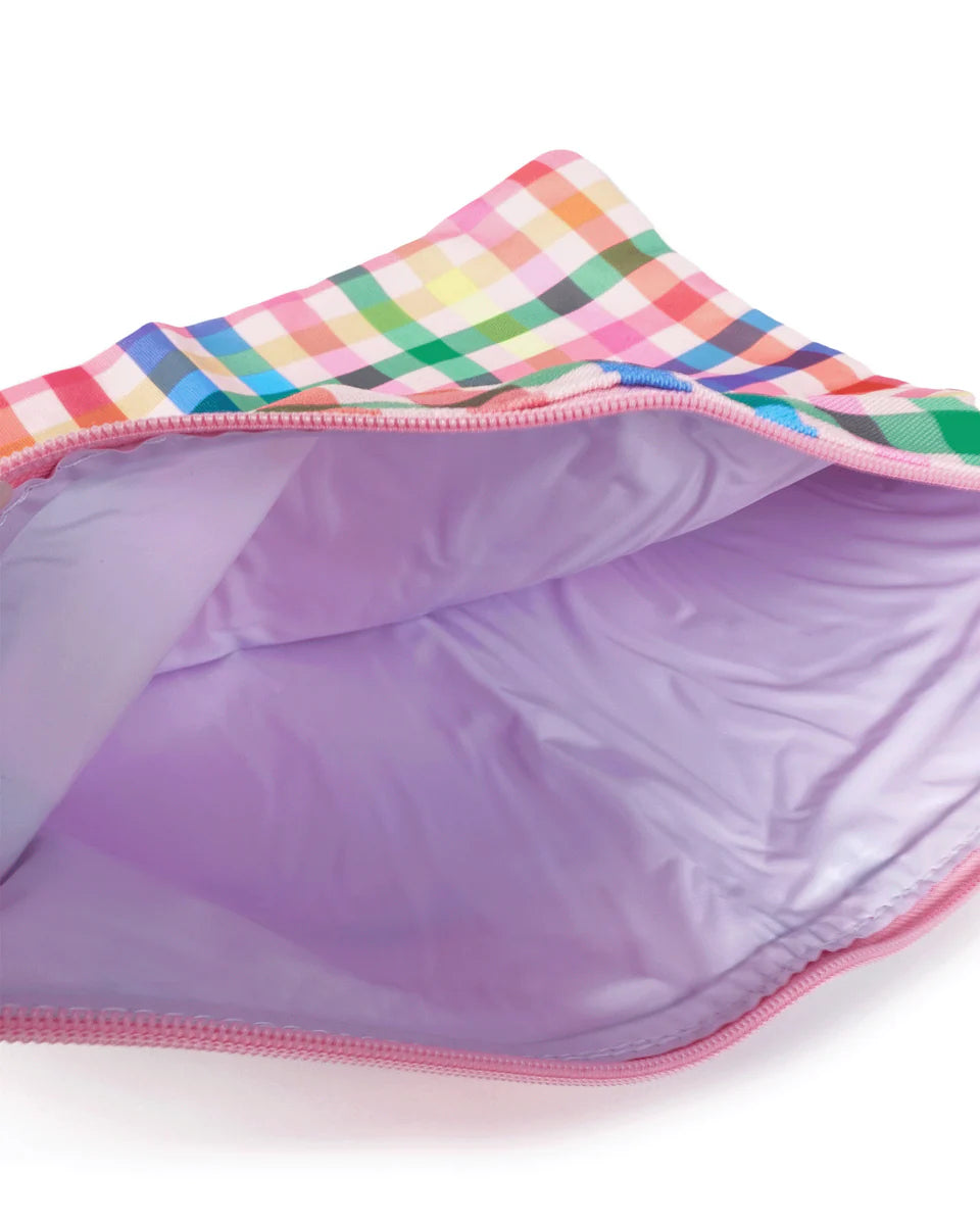 Colorful checkered fabric, showing interior with open zip on a white background