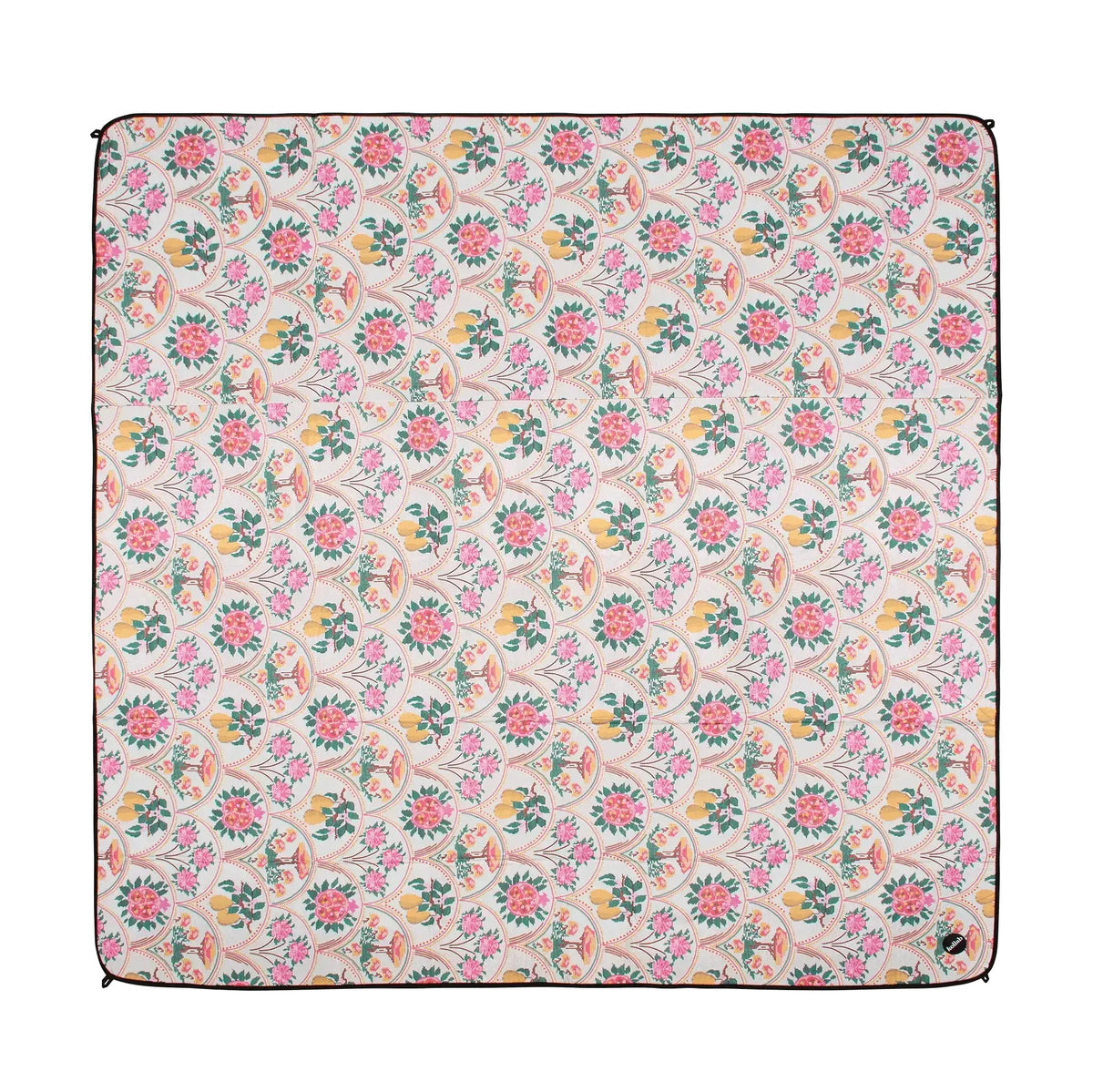 A square picnic mat, featuring a dense floral and botanical pattern in pink, green, yellow, and orange on a light cream background, finished with a dark brown piped edge.