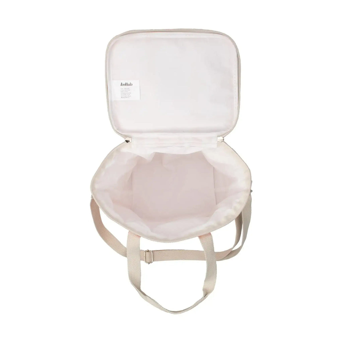 Inside of mini cooler with straps on white background.