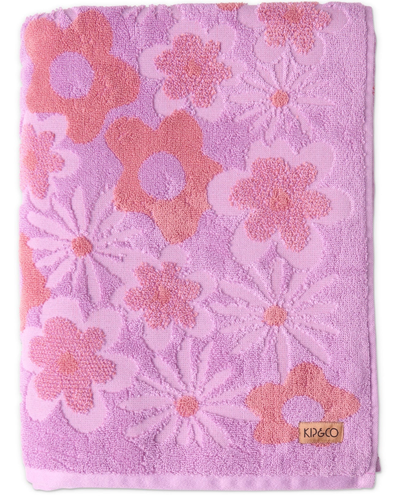 Pink towel with floral patterns and KPCB logo on a white background