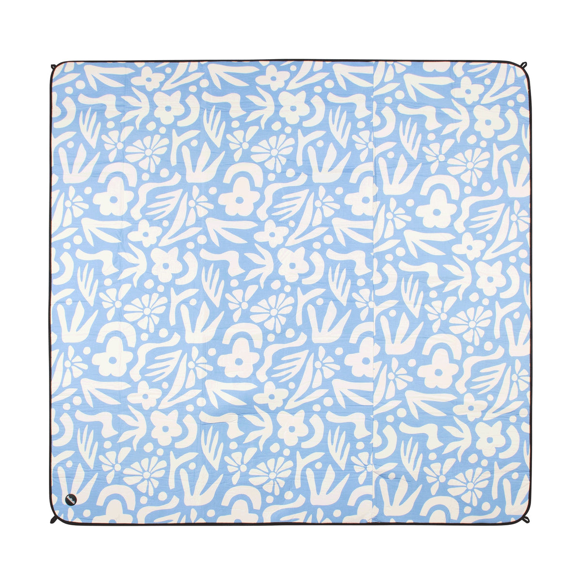 A square picnic blanket with a light blue background and a white hand-drawn style floral and leaf pattern, finished with a black stitched border.