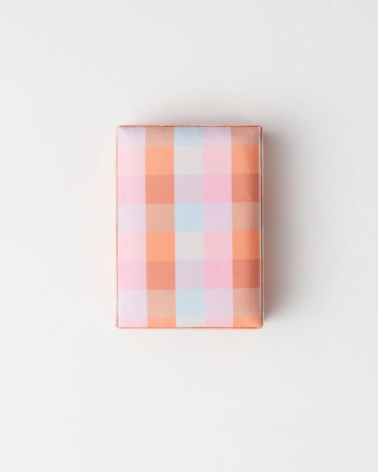 Plaid jewellery box lid, pattern colours include pink, blue and orange.
