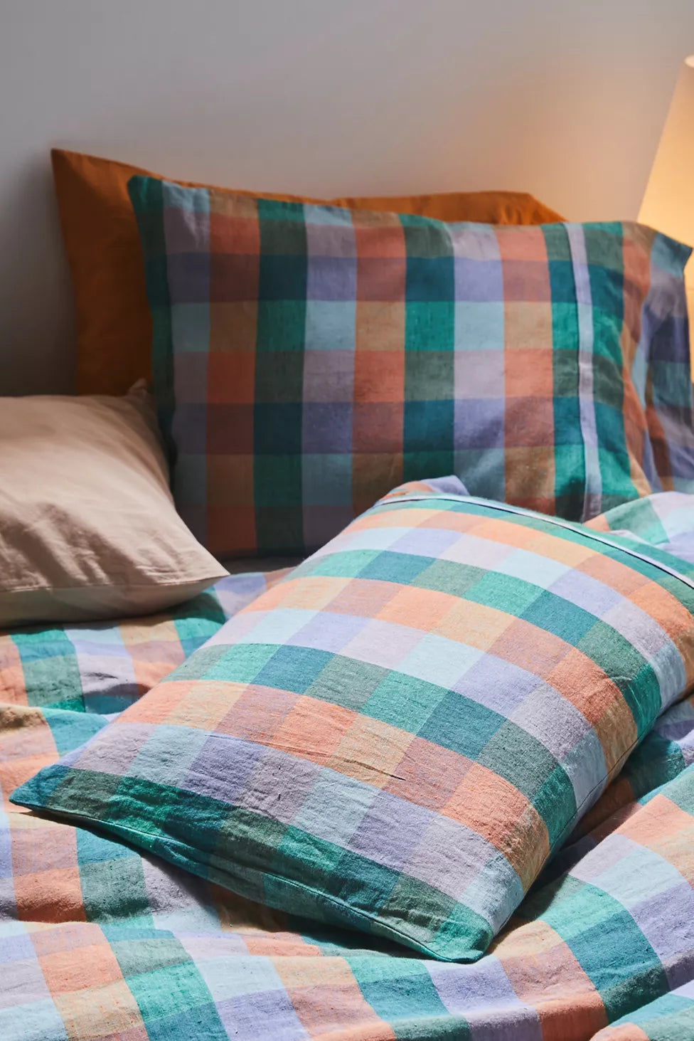 Checkered bedspread with multicolor pattern on a bed