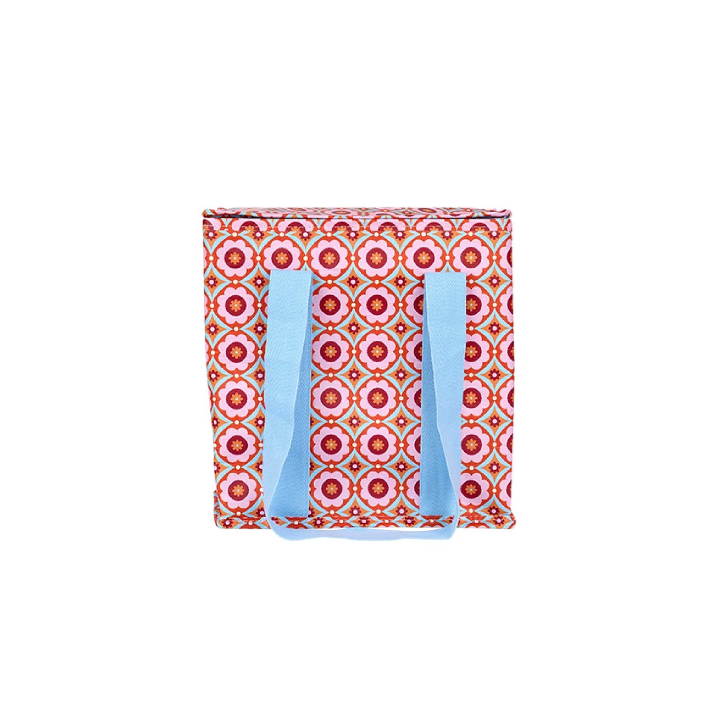 Colorful pink and red tile flower patterned bag with blue handles on a white background