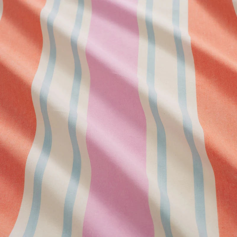 Close up of stripe bed linen, colours featured include blue, pink and watermelon/orange stripe.