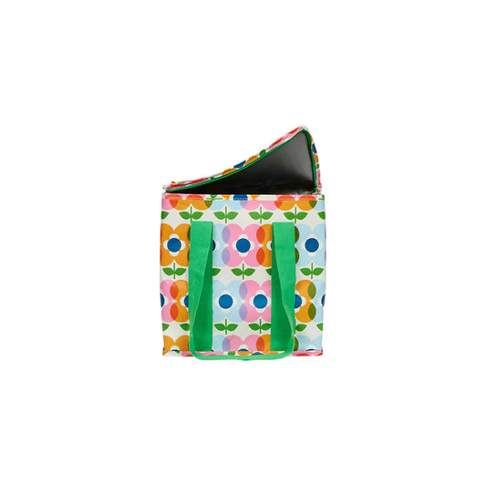 Colorful floral-patterned bag with green handles on a white background