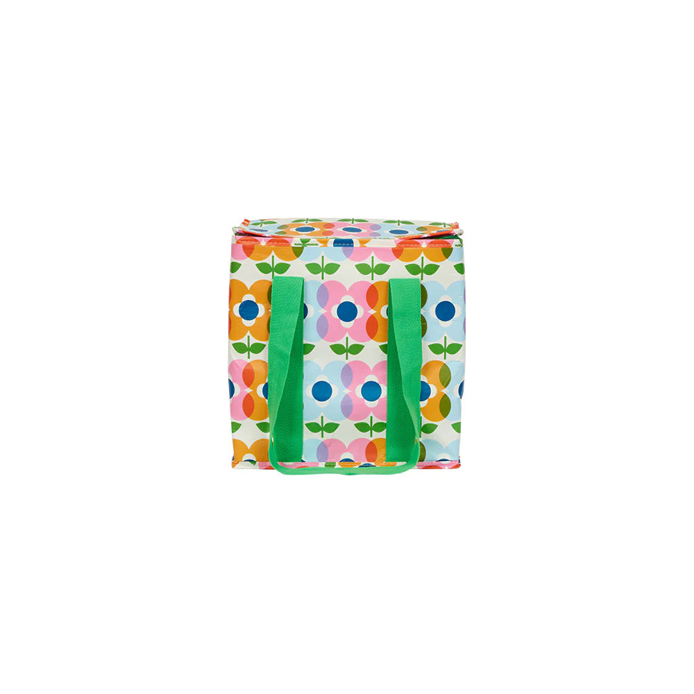 Colorful floral-patterned bag with green handles on a white background