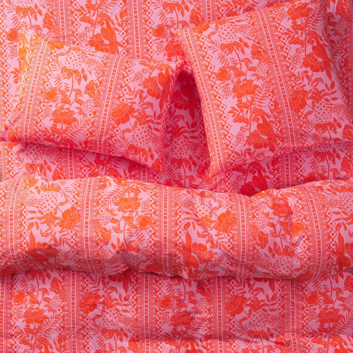 Close-up of pink and orange patterned fabric.