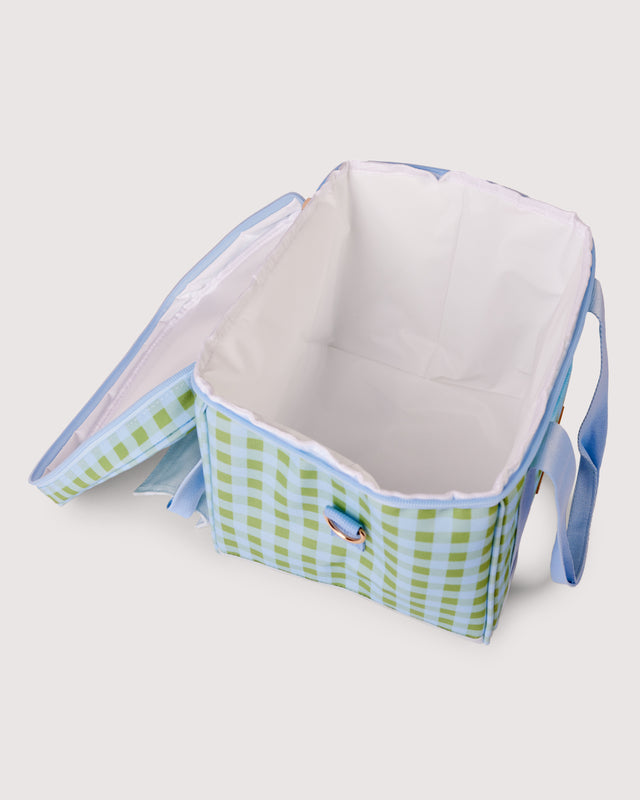 Inside of picnic bag is white, with green checkered pattern outer and blue trim on a white background