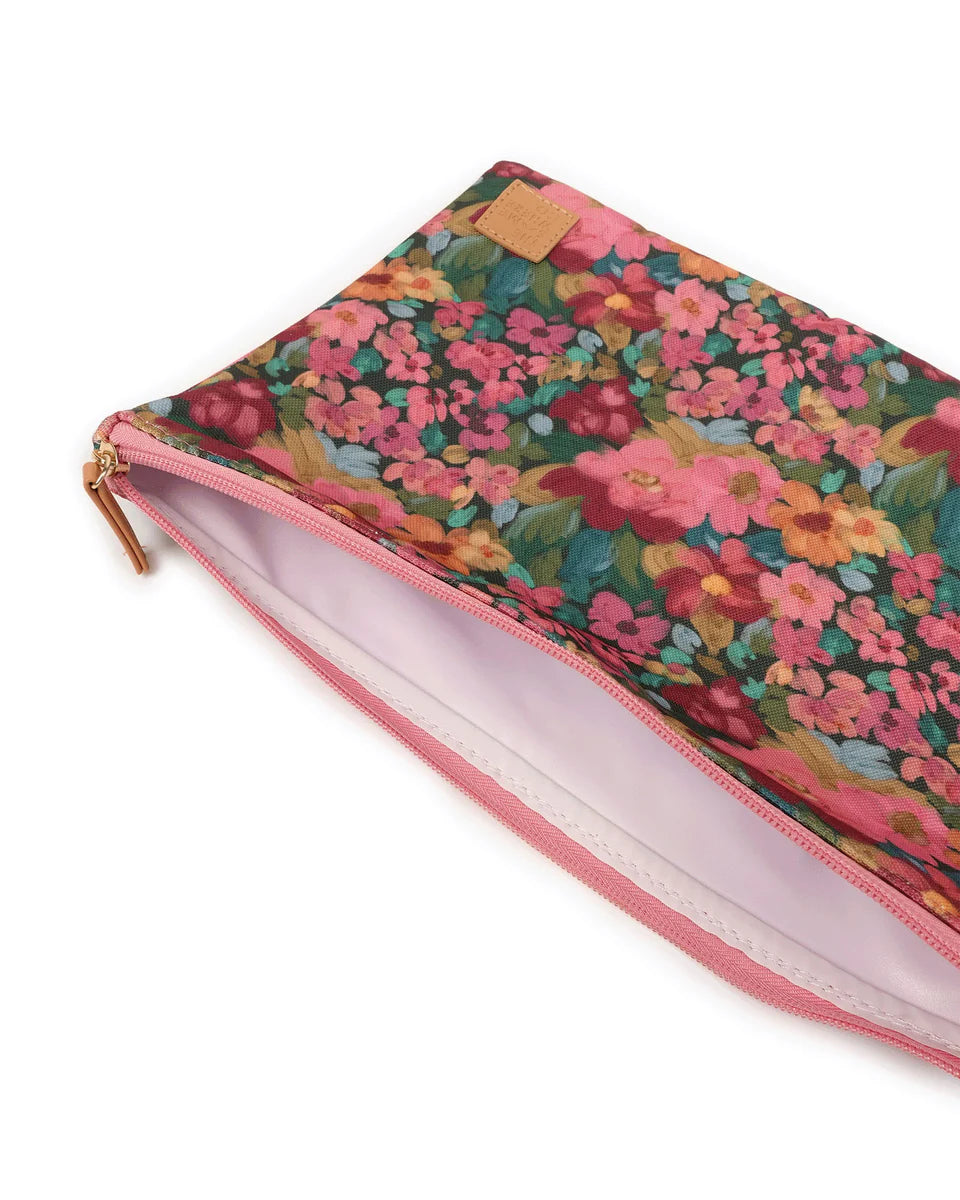 Floral-patterned pouch with a pink interior on a white background