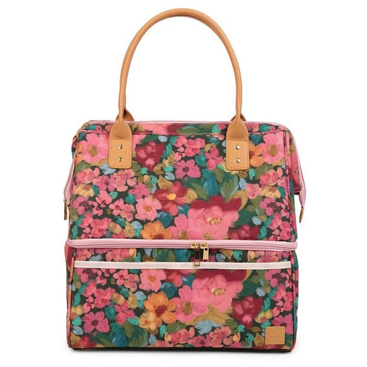 A structured tote bag with a vibrant pink, red, and orange floral print, tan leather handles, and a pink zipper closure on a white background.