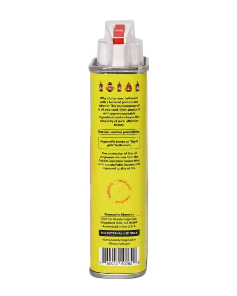 A yellow can of Argan oil shown from the back with warning text of external use only and a barcode on a white background.