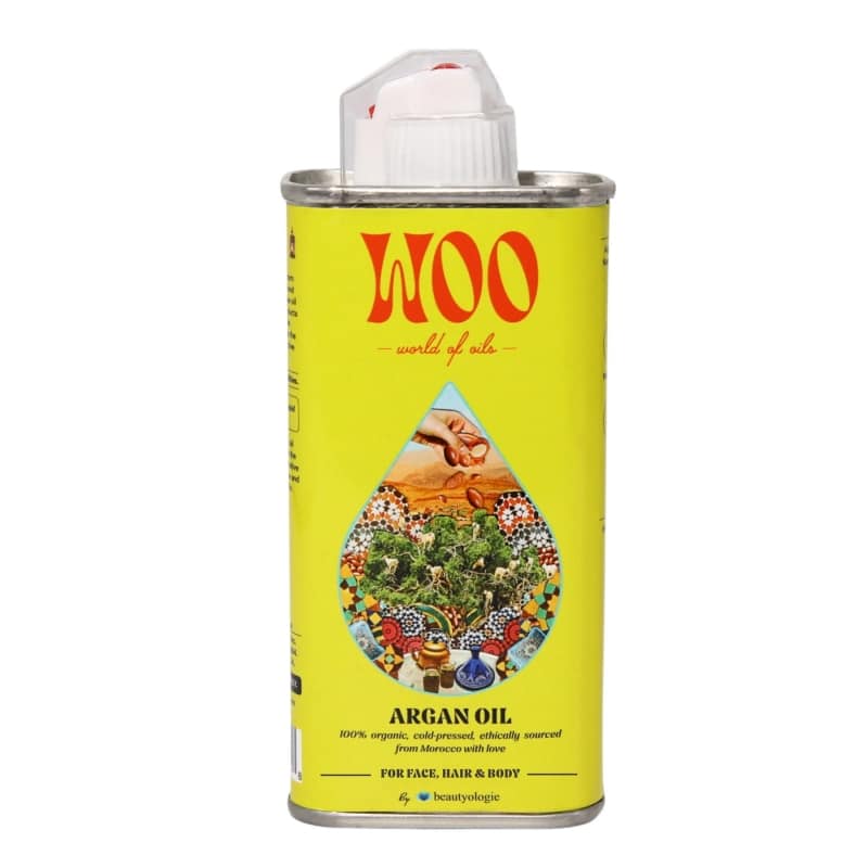 Can of Woo Argan Oil with a yellow label and white cap on a white background