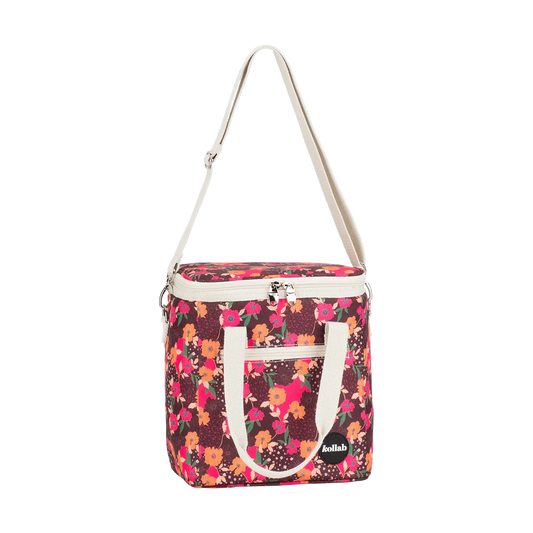 Floral-patterned bag with a white strap on a white background