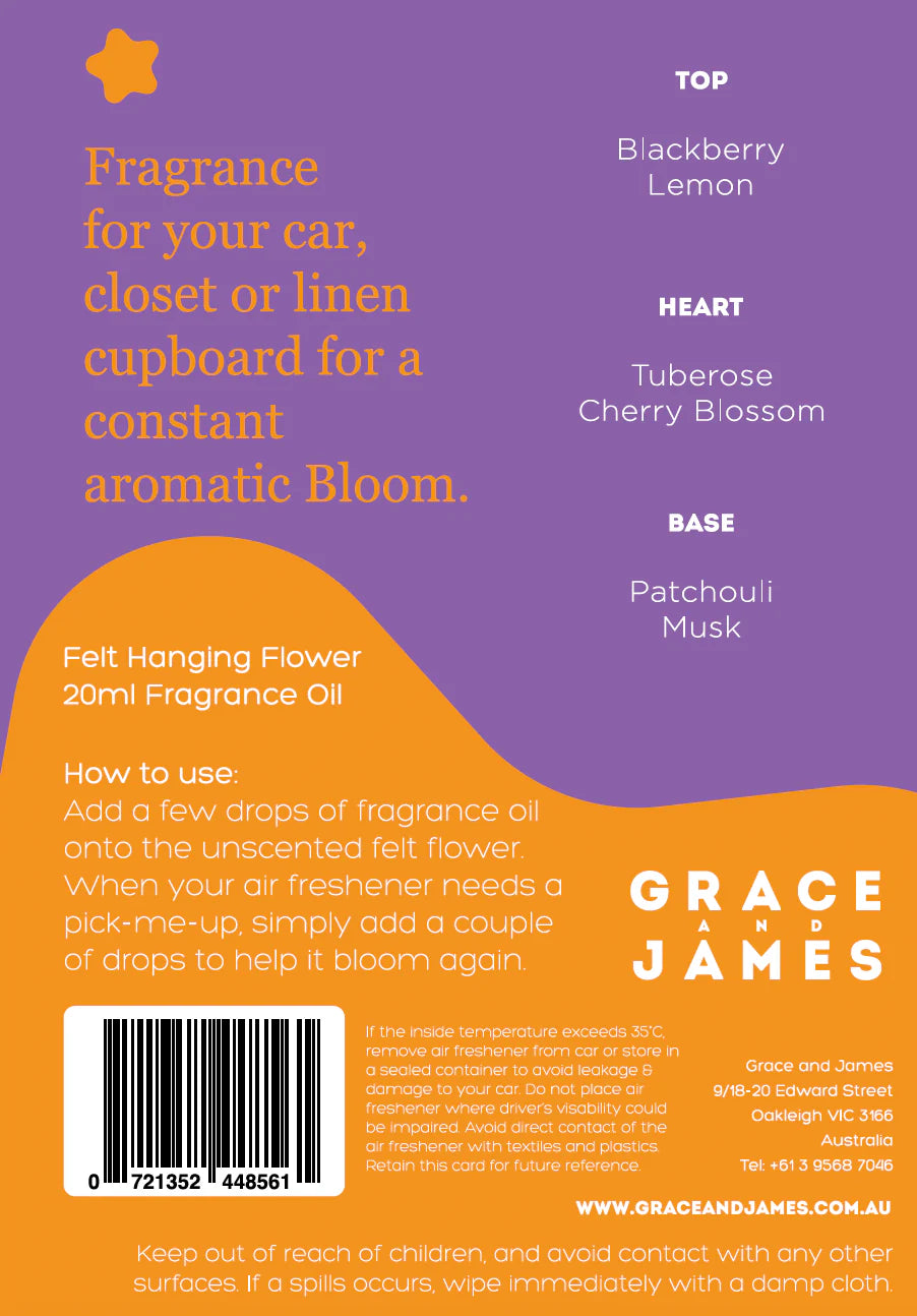 Back of a product packaging for fragrance oil with text and branding. Top scent note Blackberry and Lemon, Heart Tuberose and Cherry Blossom, Base Patchouli and Musk.