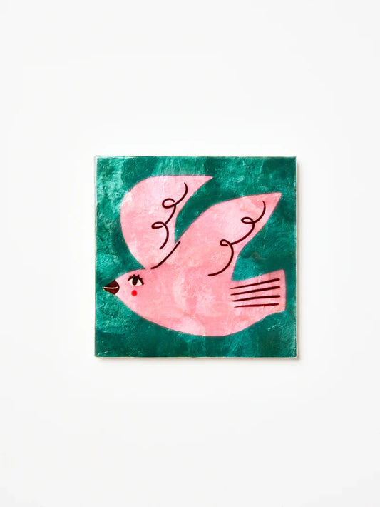 Artistic depiction of a pink bird on a green background