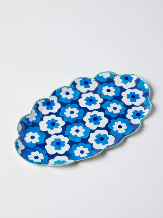 Blue and white floral-patterned ceramic dish on a light gray background