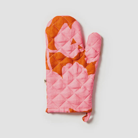 Pink and orange quilted oven mitt on a light gray background