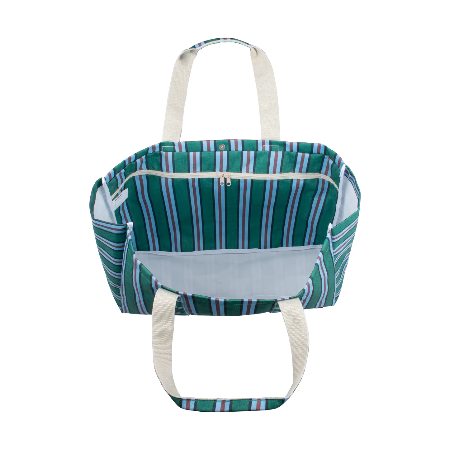 A striped tote bag with a green, blue, and white pattern, featuring cream-colored canvas handles and a zippered top opening, shown against a plain white background.