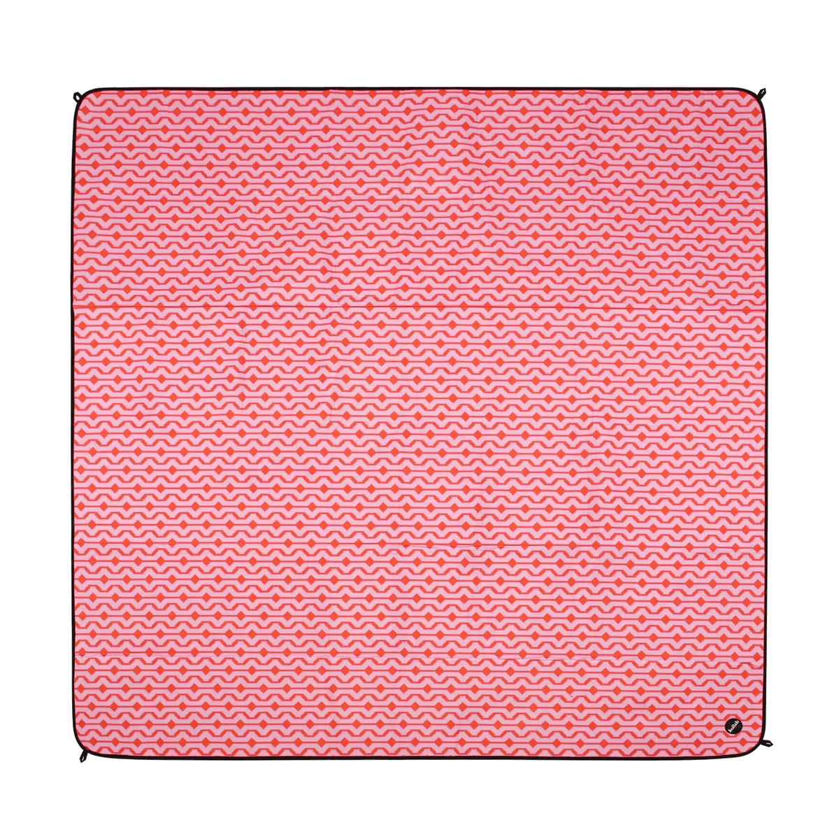Pink patterned picnic blanket on a white background.
