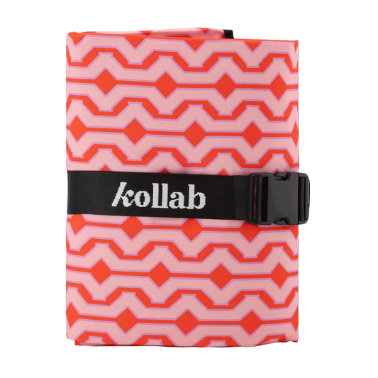 Pink and orange patterned pouch with a black strap and 'kollab' branding on a black background