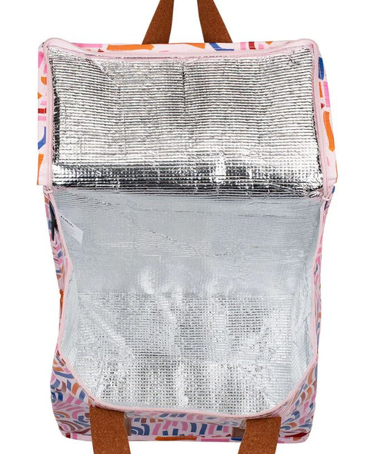 Backpack with a silver reflective panel on a colorful background