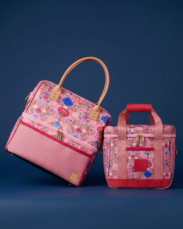 Two pink floral-patterned bags on a blue background