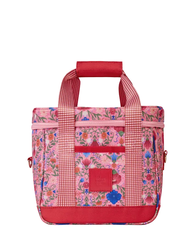 Floral-patterned bag with red accents on a light gray background