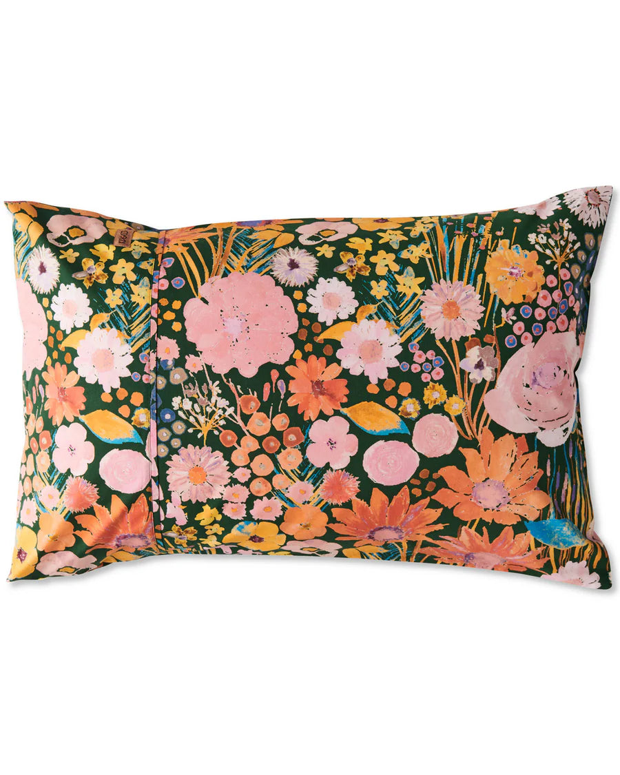 Floral patterned standard pillow, with green base white, pink and orange flowers, on a white background.