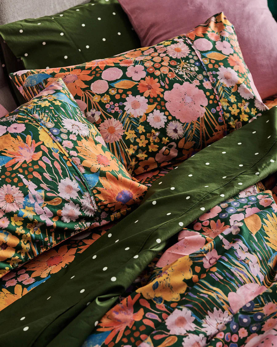 Floral and polka dot patterned fabric on a bed