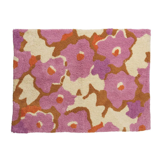 Floral patterned rug with pink, brown, and beige colors on a white background
