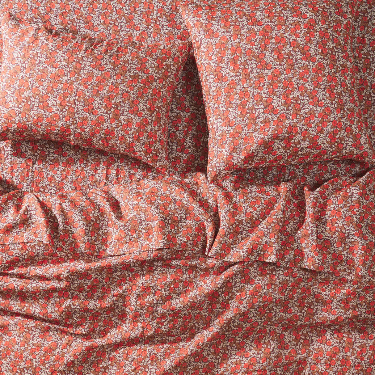 Close-up of red floral fabric with a subtle floral pattern