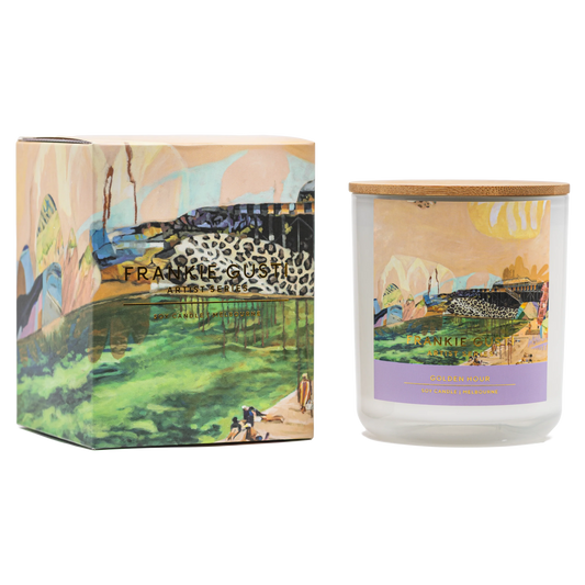 Candle and packaging with artistic design and brand name on a white background