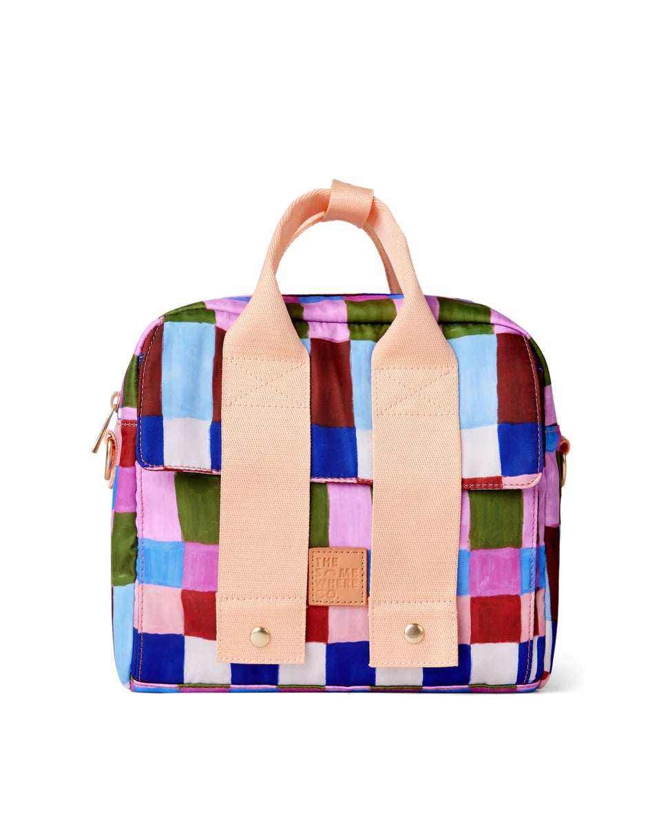 Colorful checkered bag with pink straps on a white background