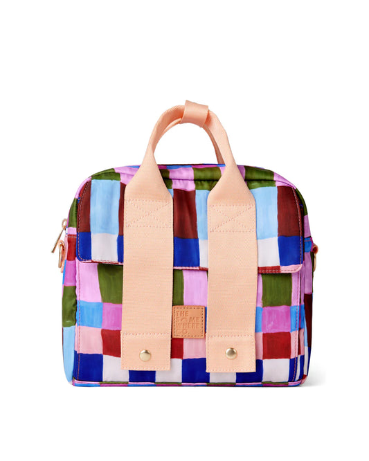 Colorful checkered bag with pink straps on a white background