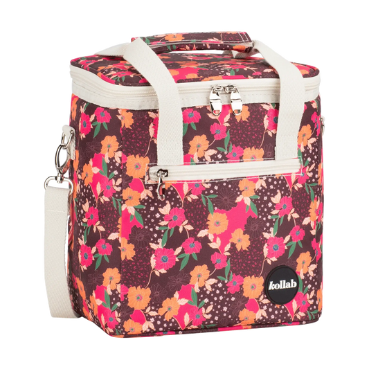 Floral patterned cooler bag with white handles on a white background