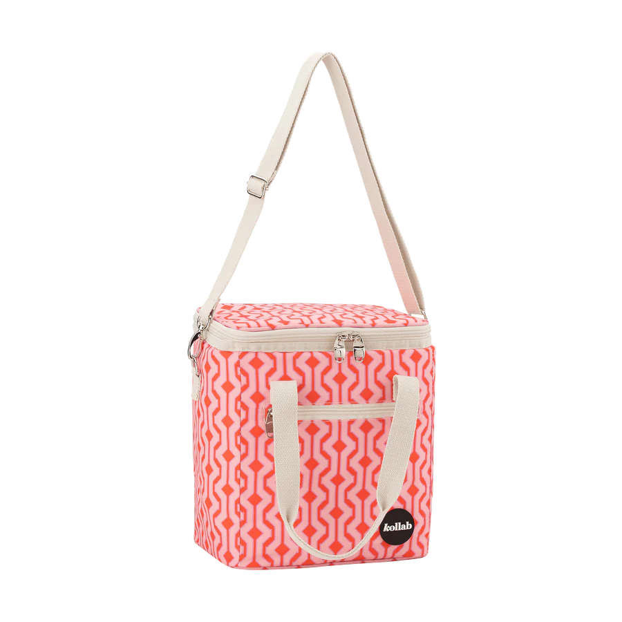 Pink and white patterned cooler bag with a shoulder strap on a white background