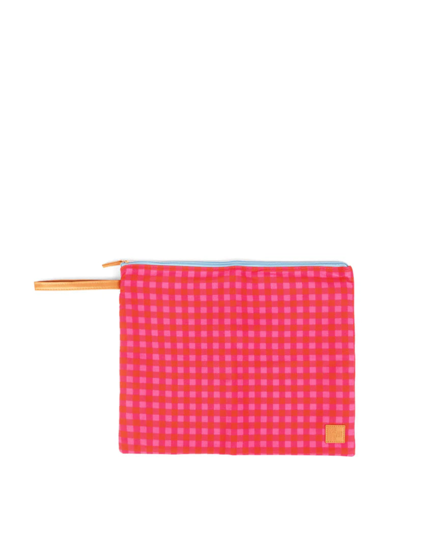 Pink checkered pouch with gold zipper on a white background
