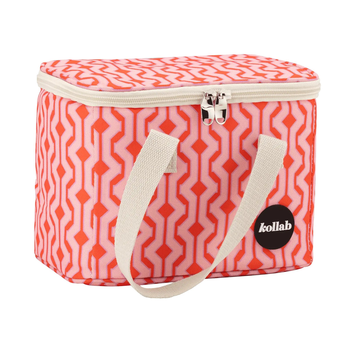 Lunch bag with cream handles, silver zip and pink orange geometric pattern.