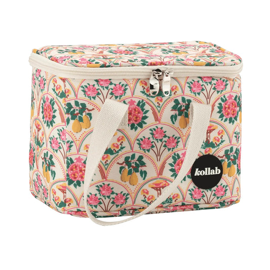 A rectangular zippered cooler bag with a cream background and a colorful floral and fruit pattern, featuring two cream fabric handles and a black circular Kollab logo patch on the front.