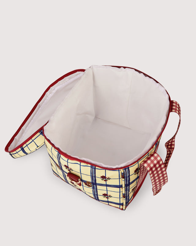 White lining of inside cooler bag with plaid pattern on a white background